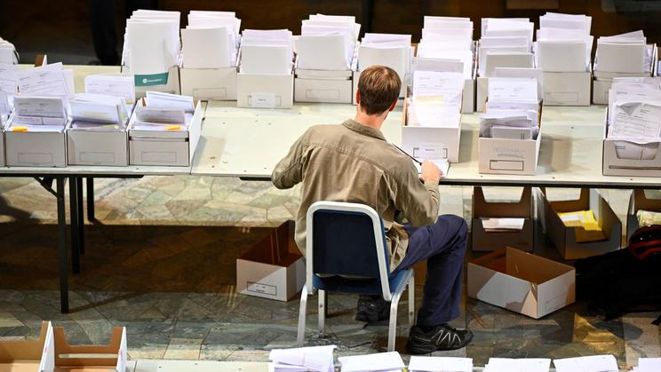 Election workers count early votes and overseas votes at Stockholm City Hall, in Stockholm
