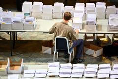 Election workers count early votes and overseas votes at Stockholm City Hall, in Stockholm
