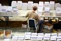 Election workers count early votes and overseas votes at Stockholm City Hall, in Stockholm