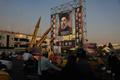 Iranian missiles are displayed next to a banner with a picture of Iran's Supreme Leader, Mojtaba Khamenei, on a street in Tehran