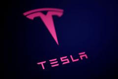 FILE PHOTO: Illustration shows Tesla logo