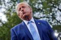 US President Donald Trump speaks to the media at the White House driveway following a luncheon for tech leaders in the East Room, in Washington