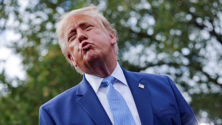 US President Donald Trump speaks to the media at the White House driveway following a luncheon for tech leaders in the East Room, in Washington