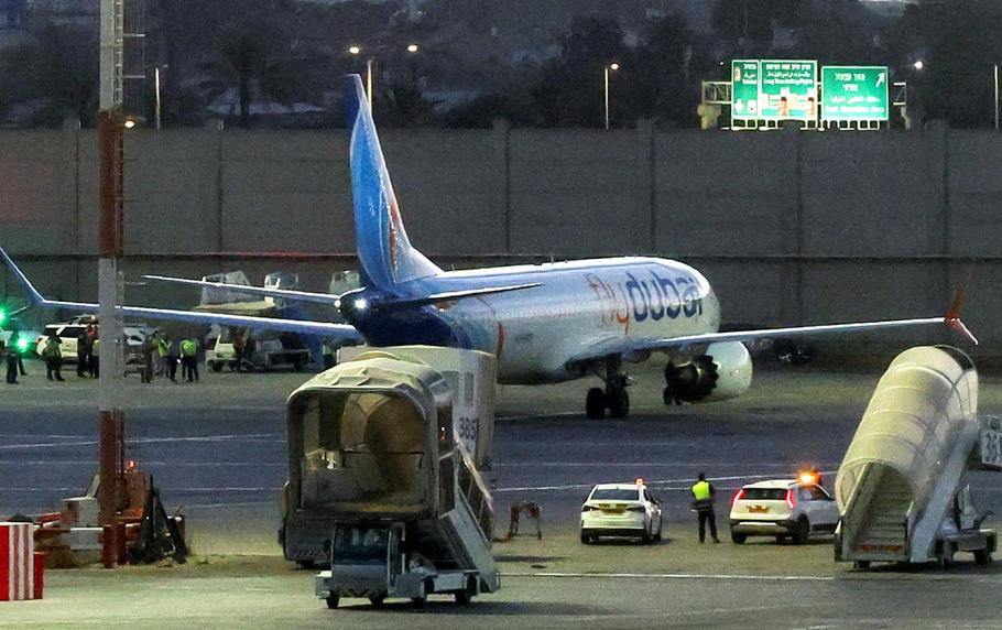 Passengers from a FlyDubai flight to Israel from United Arab Emirates that was diverted to Saudi Arabia after an emergency signal arrive at Ben Gurion International Airport