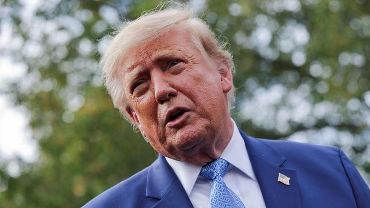 US President Donald Trump speaks to the media at the White House driveway following a luncheon for tech leaders in the East Room, in Washington