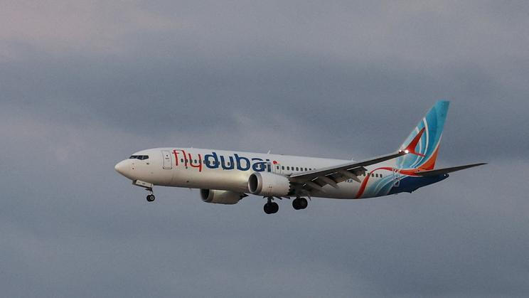 Passengers from a FlyDubai flight to Israel from United Arab Emirates that was diverted to Saudi Arabia after an emergency signal arrive at Ben Gurion International Airport