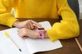 Girl,Using,Stylish,Smart,Watch,At,Wooden,Table,In,School,