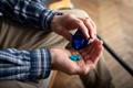 Middle,Aged,Caucasian,Man,Taking,Pills,Sitting,On,Sofa,At
