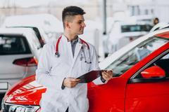 ["Car doctor with stethoscope in a car showroom"]