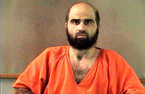 FILE PHOTO: Handout photo of Nidal Hasan, charged with killing 13 people and wounding 31 in a November 2009 shooting spree at Fort Hood.
