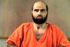 FILE PHOTO: Handout photo of Nidal Hasan, charged with killing 13 people and wounding 31 in a November 2009 shooting spree at Fort Hood.