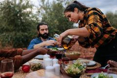 Friends,Enjoying,A,Healthy,Meal,Together,Outdoors,,With,A,Woman