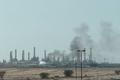 FILE PHOTO: Smoke rises from a fire at the Aramco refinery south of Riyadh