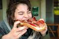 Girl,Is,Eating,Big,And,Healthy,Prosciutto,Sandwich
